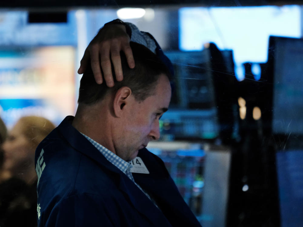 A trader works on the floor of the New York Stock Exchange on Oct. 4, 2021, in New York City. Stocks and bonds have tumbled this year as a spike in inflation has investors bracing for higher interest rates.