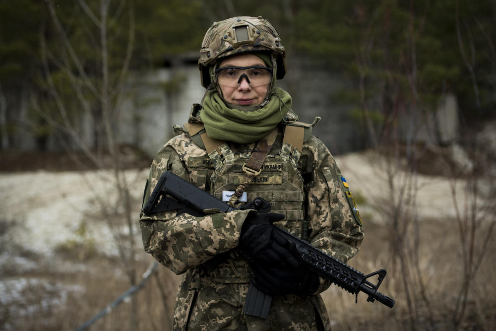 Marta Yuzkiv, a doctor who works in medical trials, poses for a portrait while training. 