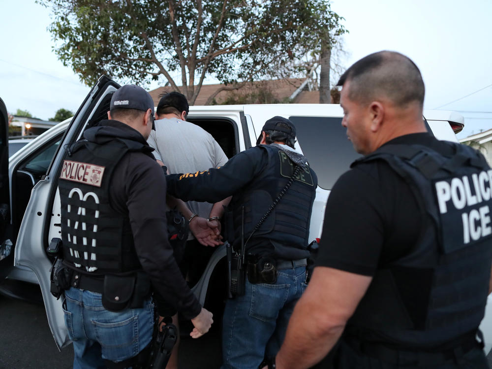 U.S. Immigration and Customs Enforcement's fugitive operations team makes an arrest at a home in Paramount, Calif., on March 1, 2020.