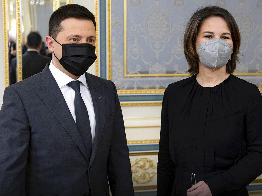 In this photo provided by Ukrainian Presidential Press Office, Ukrainian President Volodymyr Zelenskyy, left, and German Foreign Minister Annalena Baerbock pose for a photo during their meeting in Kyiv, Ukraine, Monday, Jan. 17, 2022.
