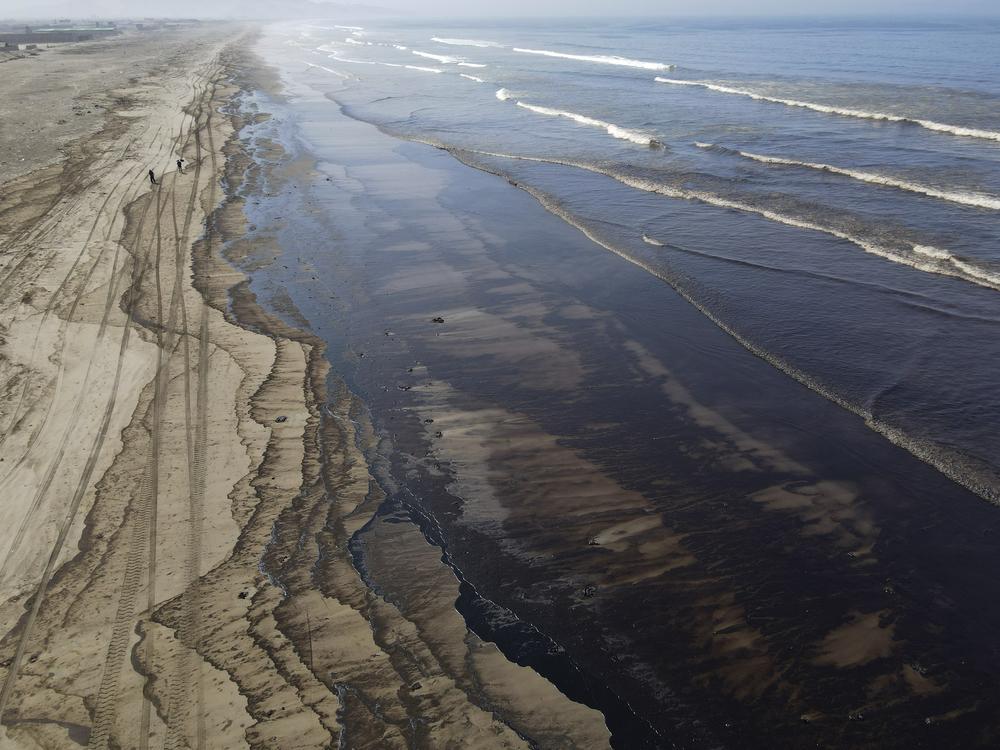 Oil pollutes Cavero beach in Ventanilla, Callao, Peru, on Tuesday after high waves attributed to the eruption of an undersea volcano in Tonga caused an oil spill.