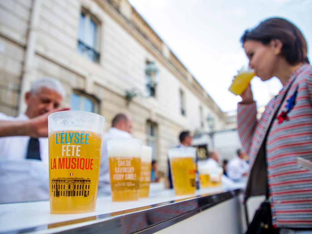 A woman drinks an alcohol-free beer during the annual 