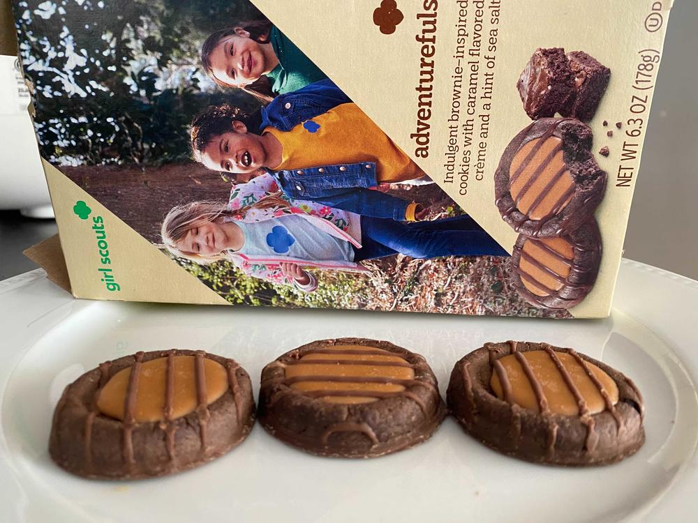 The newest Girl Scout cookie, Adventurefuls, has fallen victim to supply chain and labor disruptions. The brownie-inspired treat features a caramel-flavored creme and a dash of sea salt.