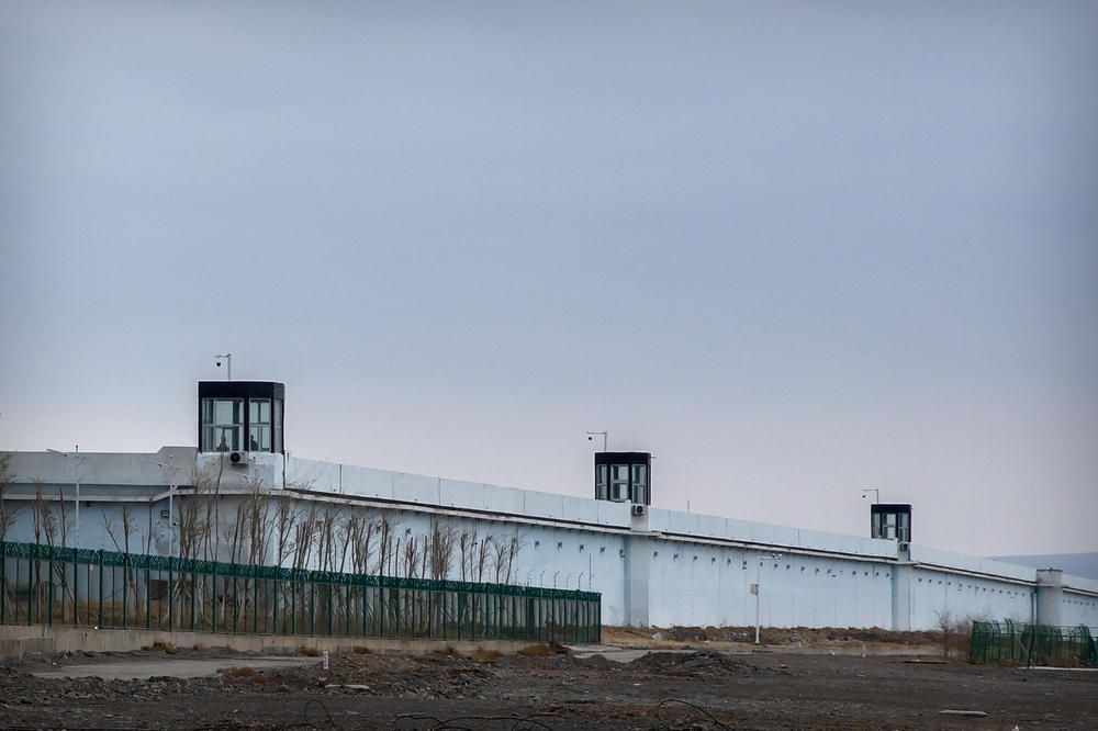 People stand in a guard tower on the perimeter wall of the Urumqi No. 3 Detention Center in Dabancheng, in western China's Xinjiang autonomous region, on April 23, 2021. China's largest detention center has room for at least 10,000 inmates.
