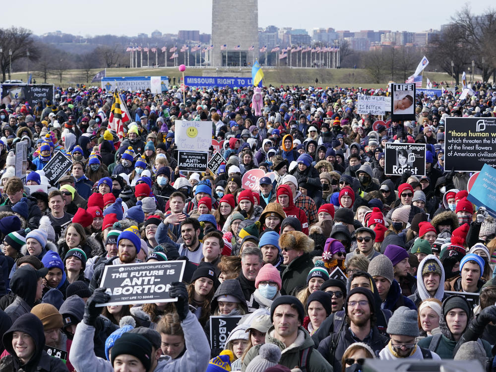 People attend the March for Life rally on the National Mall in Washington, D.C., on Friday. The march, in its 49th year, comes as a Supreme Court decision on abortion rights could unravel <em>Roe v. Wade</em>.