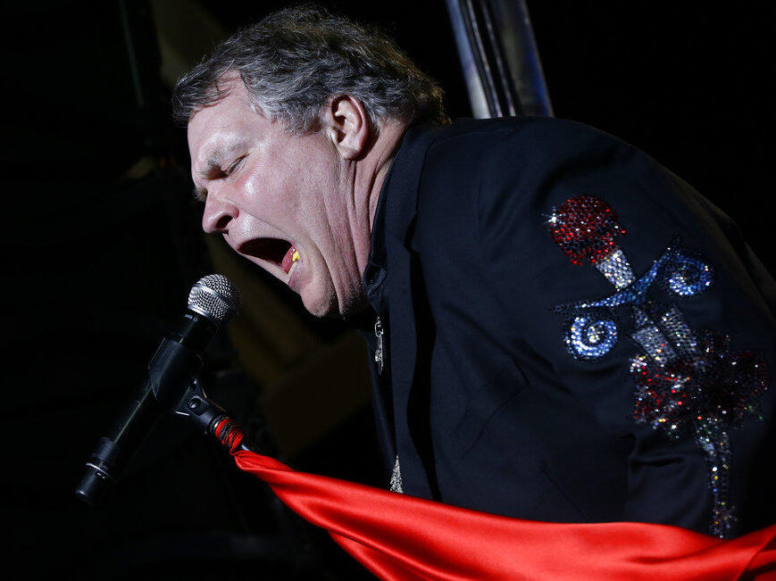 Singer Meat Loaf performs in support of Republican presidential candidate and former Massachusetts Gov. Mitt Romney at the football stadium at Defiance High School in Defiance, Ohio, Thursday, Oct. 25, 2012.