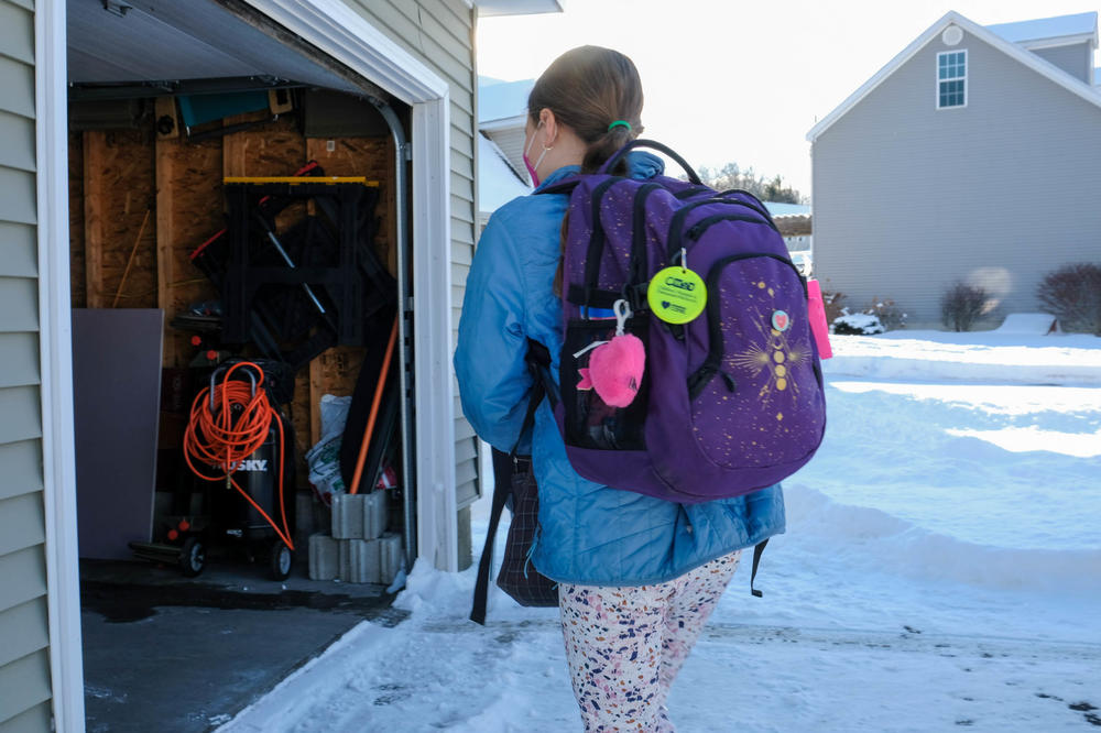 Avah Lamie arrives home from school.