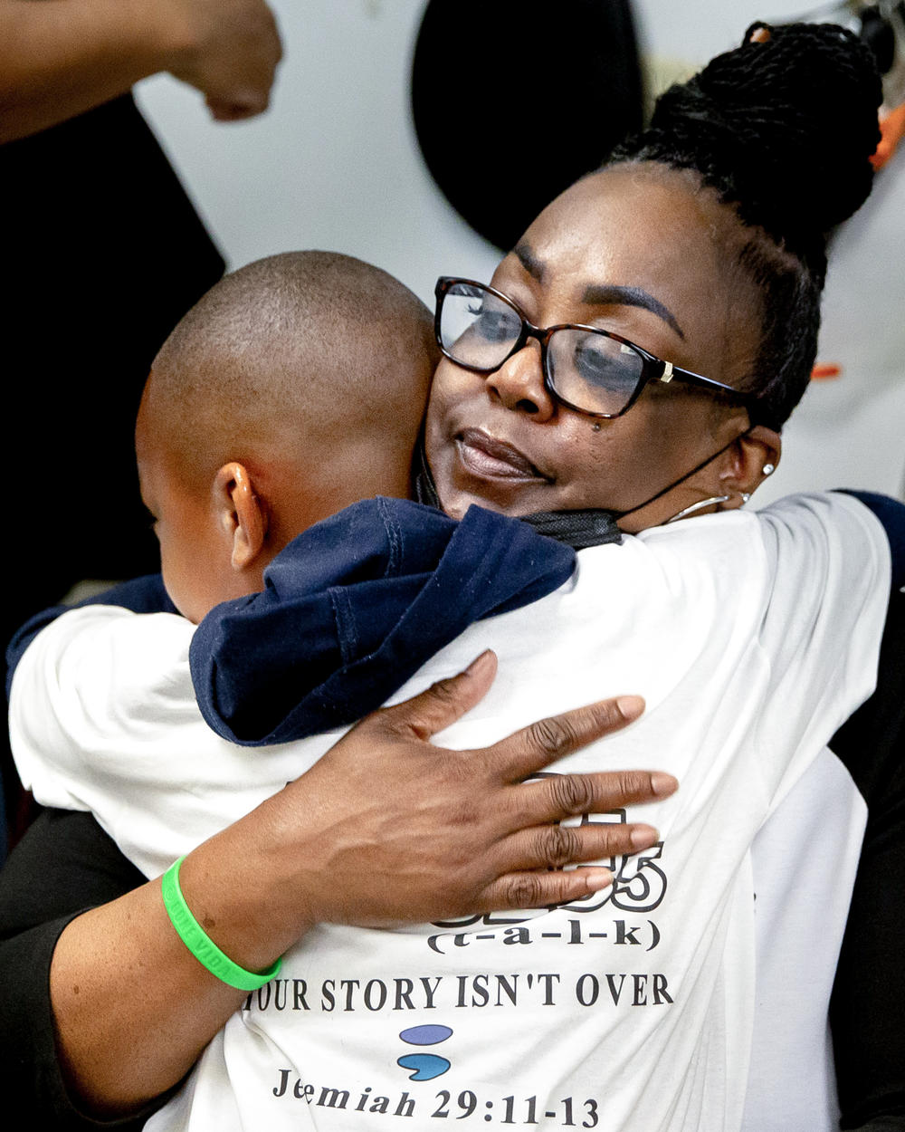 Reba Rice-Portwood hugs her grandson Jackson Portwood, after he got a haircut from barber Michael Blissitt at Elle' Inner-city Salon in St. Louis, Missouri.