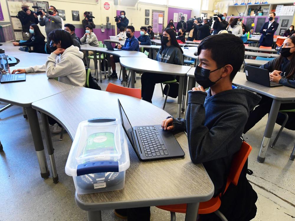 Seventh and eighth grade students attend class at Olive Vista Middle School on Jan. 11 in Sylmar, Calif. Los Angeles students will be required to wear non-cloth masks.