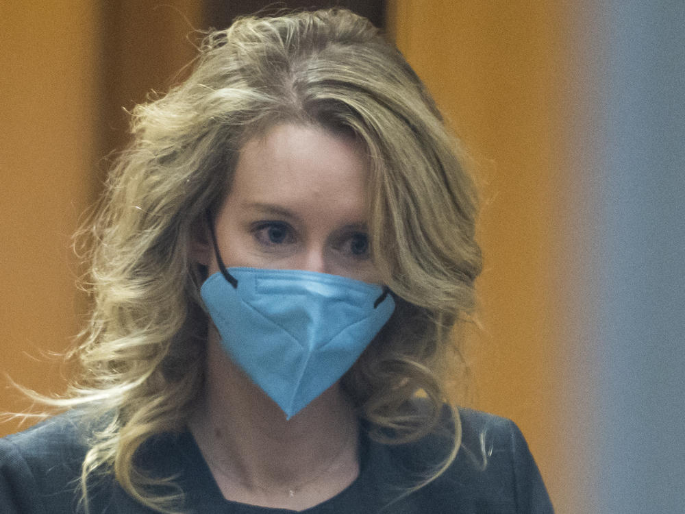 Elizabeth Holmes walks into federal court in San Jose, Calif., in January 2022.