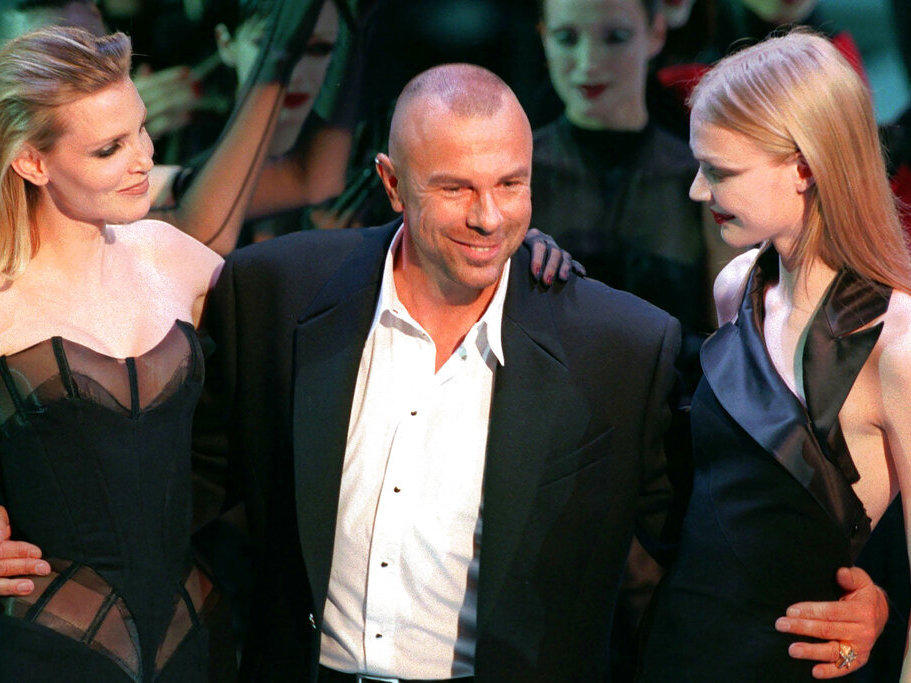 French fashion designer Thierry Mugler on the catwalk with unidentified models after the presentation of his 1998-99 fall-winter ready-to-wear collection presented in Paris on March 15, 1998.