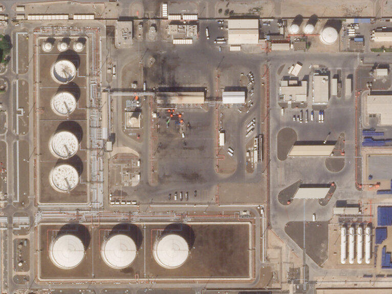This satellite image provided Planet Labs PBC shows the aftermath of an attack claimed by Yemen's Houthi rebels on an Abu Dhabi National Oil Co. fuel depot in the Mussafah neighborhood of Abu Dhabi, United Arab Emirates, Saturday, Jan. 22, 2022.