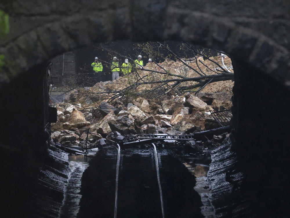 A road collapsed onto train tracks in Baltimore, Md. in 2014 after heavy rain. The city is facing millions of dollars in infrastructure upgrades to cope with the effects of climate change.