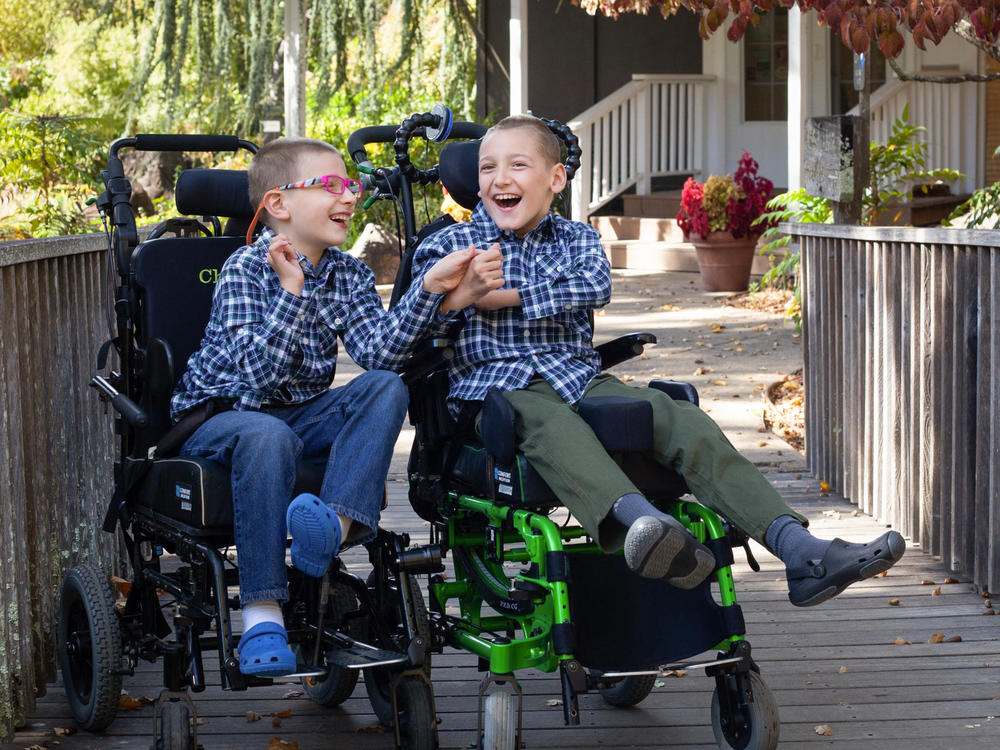 Brothers Chase Miller (left), 10, and Carson Miller, 11, in November 2021. The two brothers have a rare genetic disorder and are immunocompromised. Their family has to practice extreme caution to prevent coronavirus exposures.
