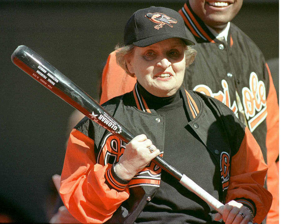 Albright holds a bat before throwing out the first pitch before the game between the Kansas City Royals and the Baltimore Orioles during opening day at Camden Yards in 2002.