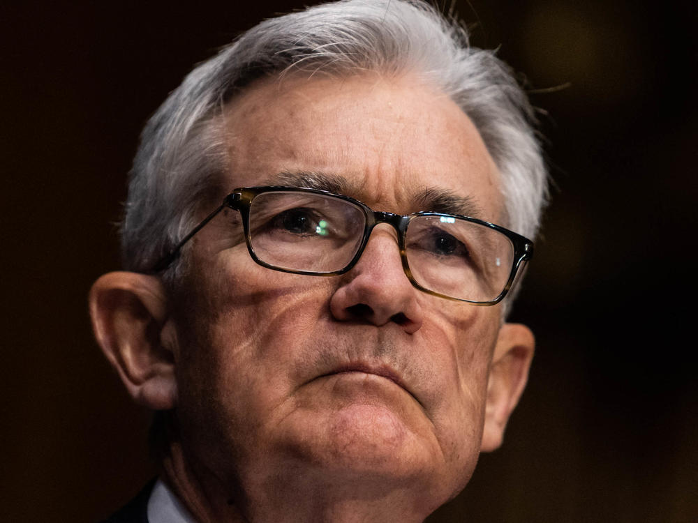 Federal Reserve Chair Jerome Powell listens during his renomination hearing with the Senate Banking Committee on Jan. 11. The Fed is planning to become more aggressive in fighting inflation.