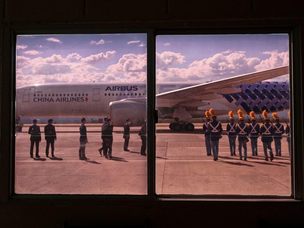 Cadets march towards the plane of Taiwan Vice President William Lai, arriving in Honduras on Jan. 26 for the inauguration of Xiomara Castro.