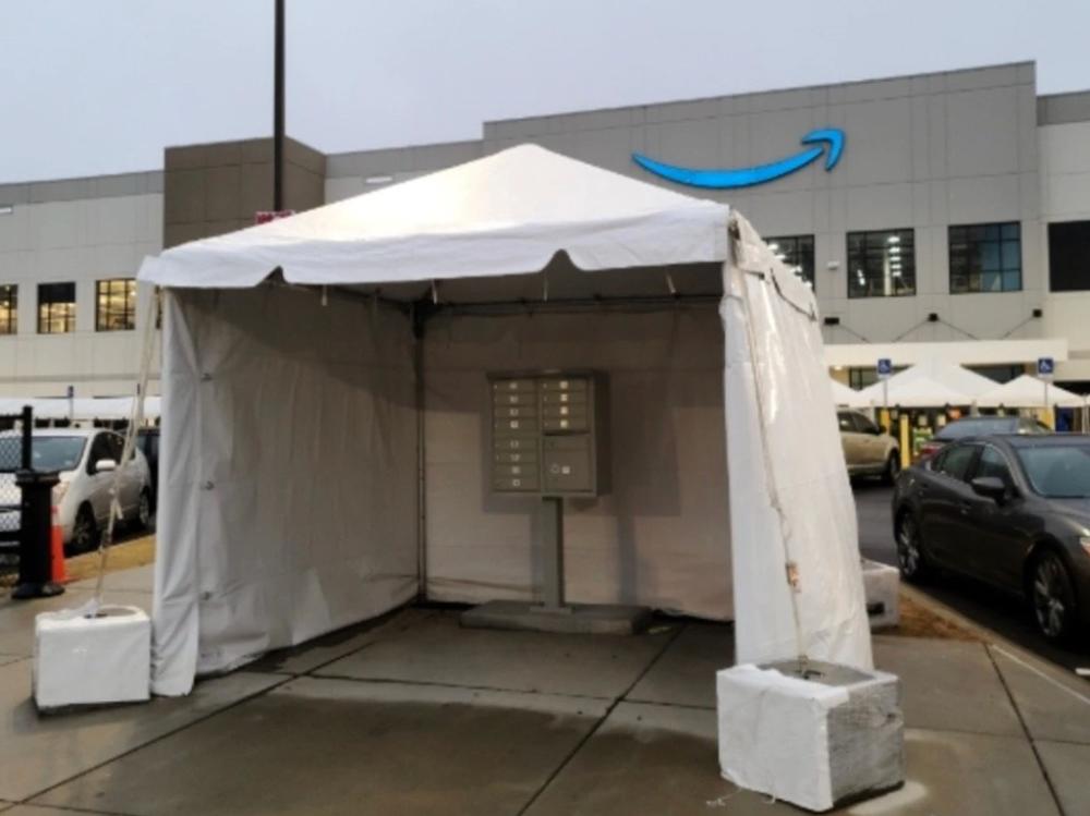 During last year's high-profile union vote, an Amazon-branded tent cloaks a mailbox outside the company's warehouse in Bessemer, Ala.