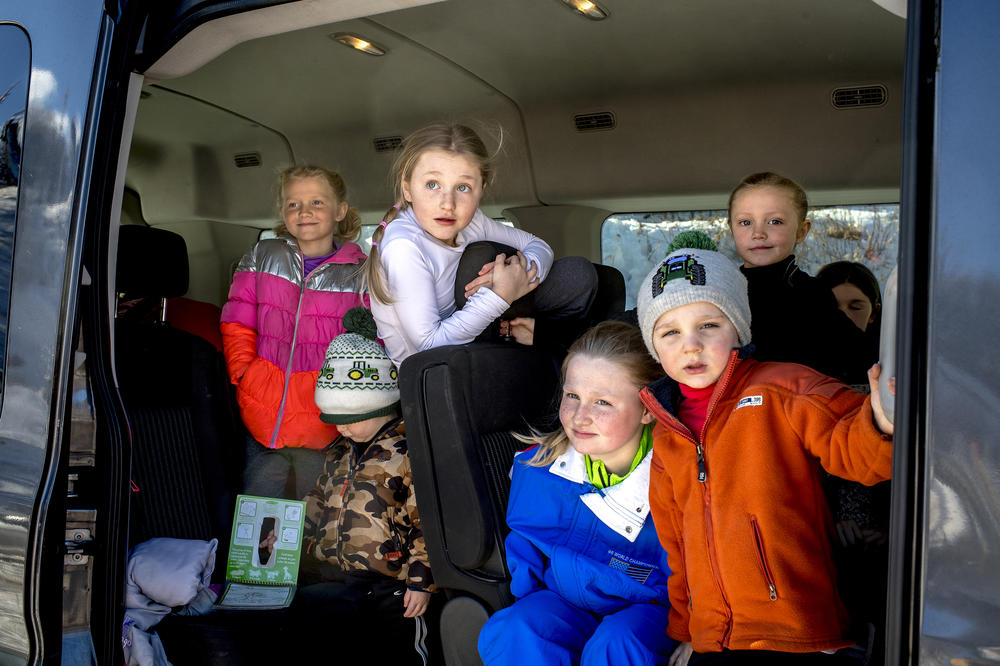 The Jacobson family arrives at the Suicide Hill Ski Bowl in Ishpeming, Mich. on March 5, 2021. Veronica Jacobson and her husband, Ty Jacobson, met through ski jumping and now have 7 out of their 11 children competing in the sport. They travel as a family to compete in various ski jumping tournaments.