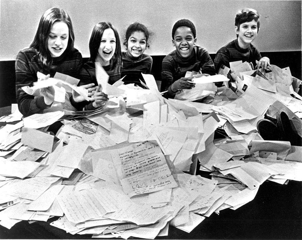 Zoom cast members pose with viewers' mail.