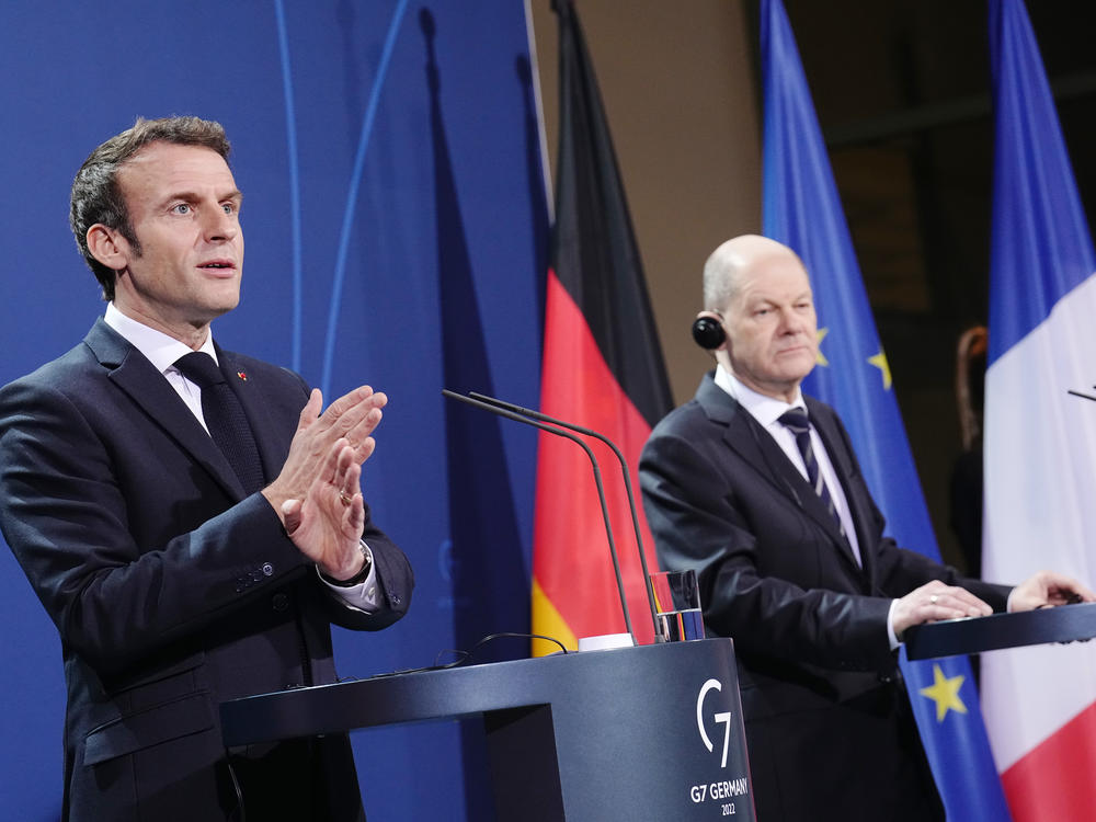 German Chancellor Olaf Scholz and French President Emmanuel Macron give a joint press conference ahead of talks at the Chancellery on Tuesday in Berlin.