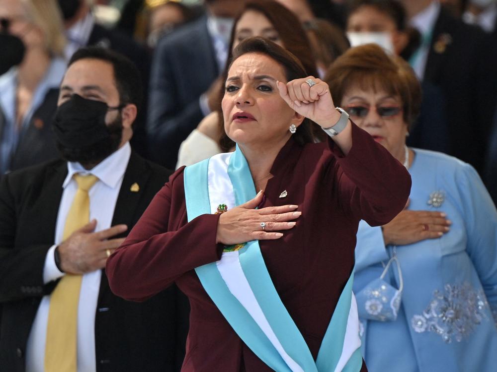Honduran President Xiomara Castro holds up her fist after being sworn in during her inauguration ceremony in Tegucigalpa.