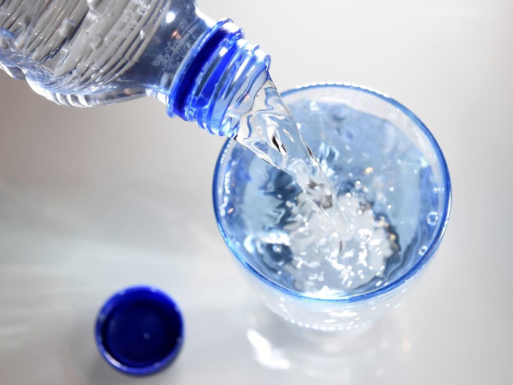 A glass is filled in with water on April 27, 2014 in Paris. Scientists studying what makes us thirsty have found the body checks in on our water consumption in several different ways.