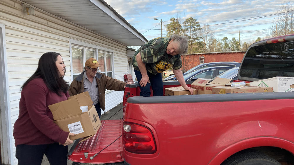 Cheri Goodwin and former miners load up supplies from the union's pantry to bring to the United Mine Workers of America rally.