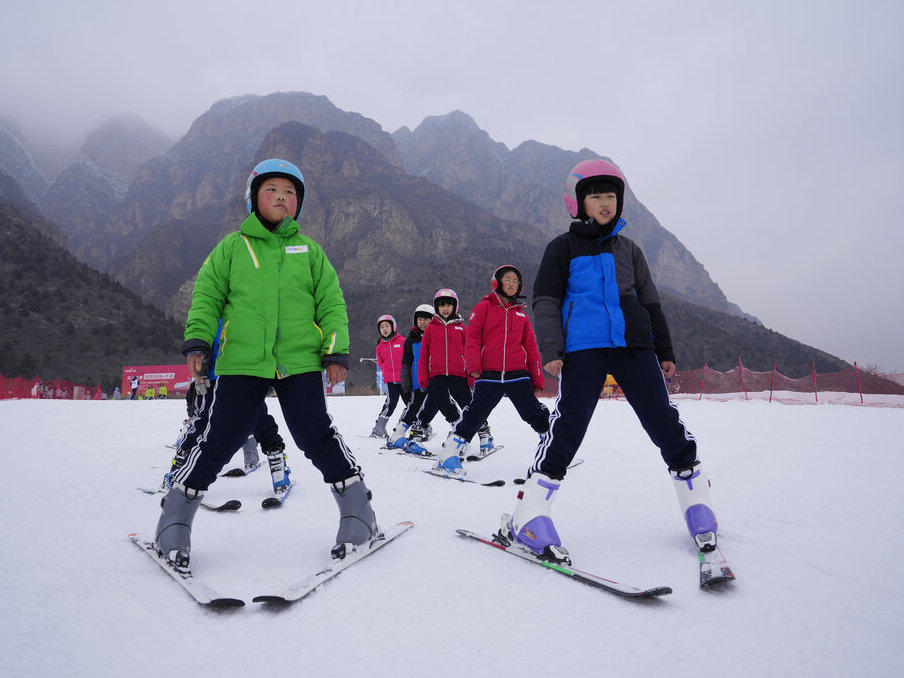 School children learning to ski take to the slope at the Vanke Shijinglong Ski Resort in Yanqing on the outskirts of Beijing, China, Thursday, Dec. 23, 2021.