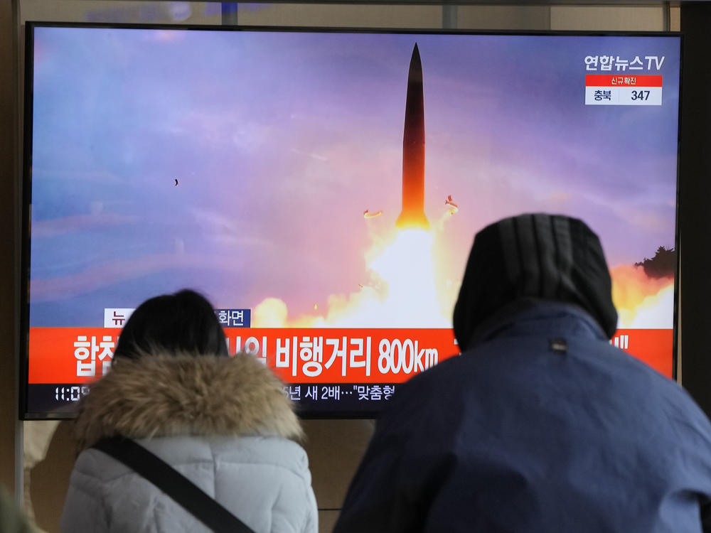 People watch a TV showing a file image of North Korea's missile launch during a news program at the Seoul Railway Station in Seoul, South Korea, on Sunday, the North's seventh missile test this month.