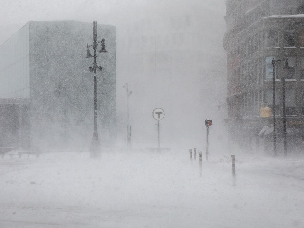 Heavy snowfall with high winds creates whiteout conditions in Boston. More than 100,000 are without power in Massachusetts as of Saturday afternoon.