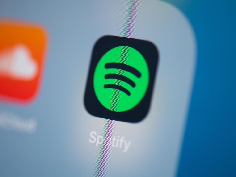 Spotify says it will add a content advisory to podcasts that discuss COVID-19.