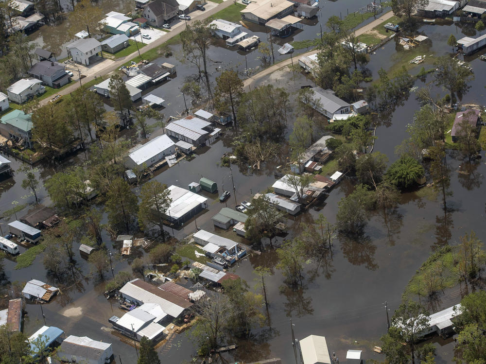 Heavy rain and storm surge from Hurricane Ida caused flooding from Louisiana to New England in September 2021. Homes in the town of French Settlement, La., were still underwater four days after the storm made landfall. Climate change is driving more flood risk in the U.S.
