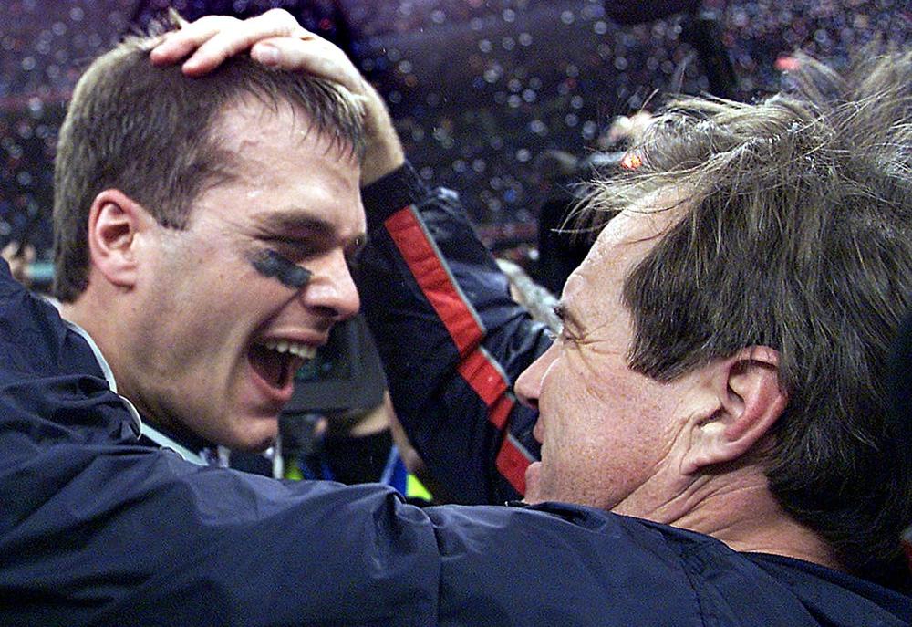 Brady and Patriots head coach Bill Belichick celebrate after Brady's first Super Bowl win, in February 2002. Brady and Belichick would win six Super Bowls together.