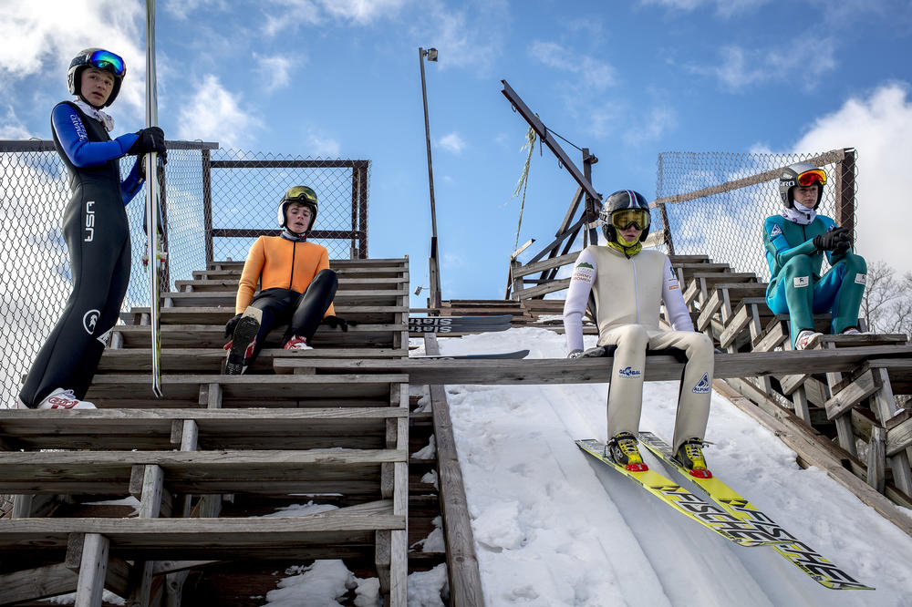 From left, Oliver Jacobson, 16, of Stillwater, Minn., Gavin Mjolsness, 14, of Itasca, Minn., Jacob Fuller, 19, of McHenry, Ill. and Gabriel Jacobson, 14, of Stillwater, Minn. prepare to jump the 60-meter hill during practice ahead of the 134th annual ski jumping tournament at the Suicide Hill Ski Bowl in Ishpeming, Mich. on March 6, 2021.