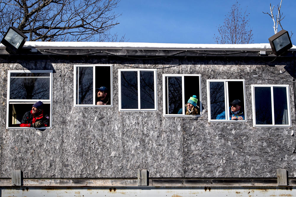 Judges watch as ski jumpers jump the 60-meter ski jump during the 134th annual ski jumping tournament at the Suicide Hill Ski Bowl in Ishpeming, Mich. on March 6, 2021. Jumpers are scored based on the distance they jump as well as the style of their flight, alongside gate and wind compensation points.