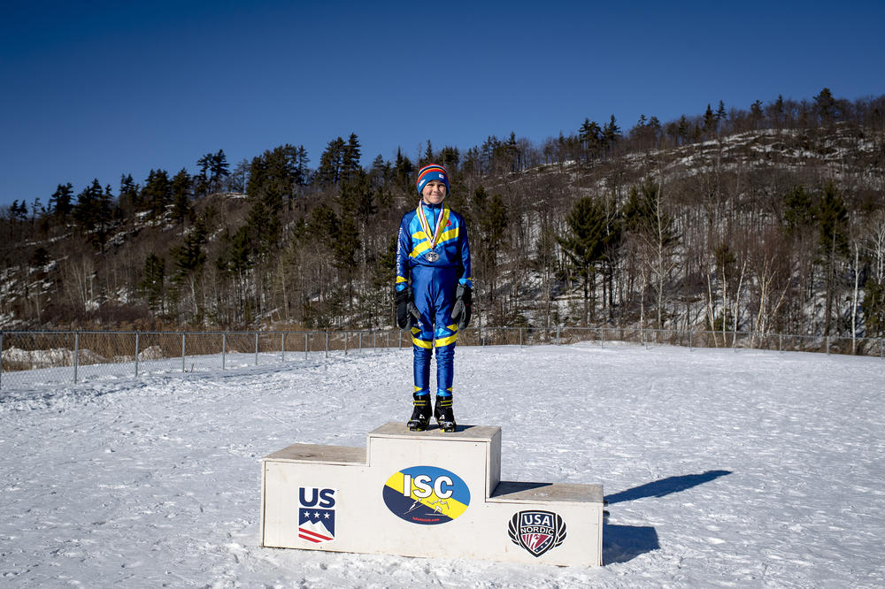 Cole Becker, 12, is awarded first place in his class for competing in the 134th annual ski jumping tournament at the Suicide Hill Ski Bowl in Ishpeming, Mich. on March 6, 2021.