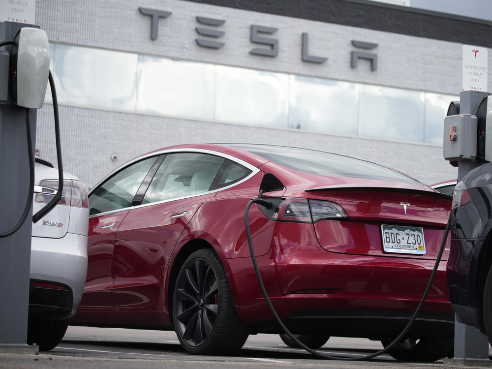 A 2021 Model 3 sedan sits in a lot at a Tesla dealership in Littleton, Colo., on June 27, 2021. Tesla is recalling nearly 54,000 vehicles because their 