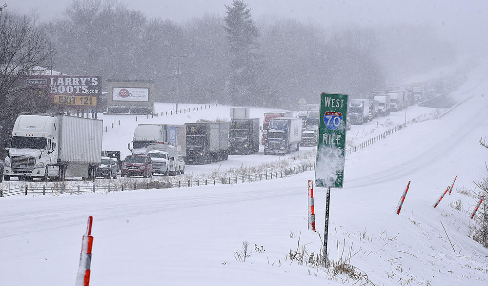 Traffic along eastbound Interstate 70 is halted on Wednesday in Columbia, Mo., following several accidents after a winter storm dumped several inches of snow.