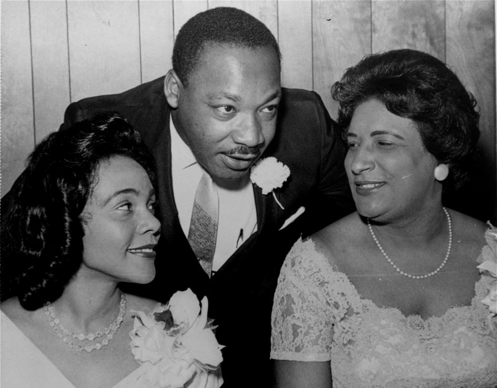In this Aug. 9, 1965, file photo, Dr. Martin Luther King, Jr. chats with his wife, Coretta, left, and civil rights champion Constance Baker Motley before the start of an S.C.L.C. banquet in Birmingham, Ala.