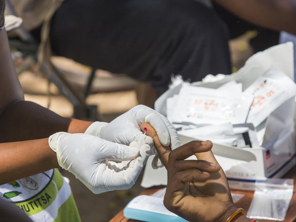 Testing blood for malaria at a Doctors Without Borders clinic in Malawi.