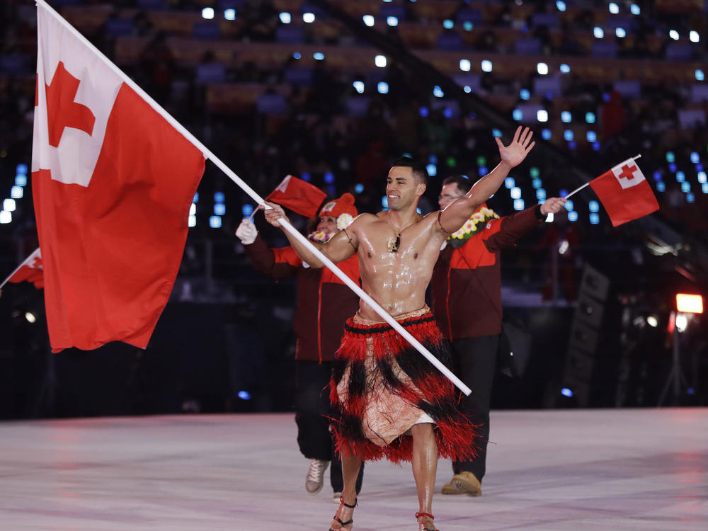 Pita Taufatofua makes an entrance during the opening ceremony of the 2018 Pyeongchang Winter Olympics. Taufatofua competed in taekwondo and cross-country skiing, but he's most famous for carrying the flag of Tonga for three consecutive Games, stealing the show each time.