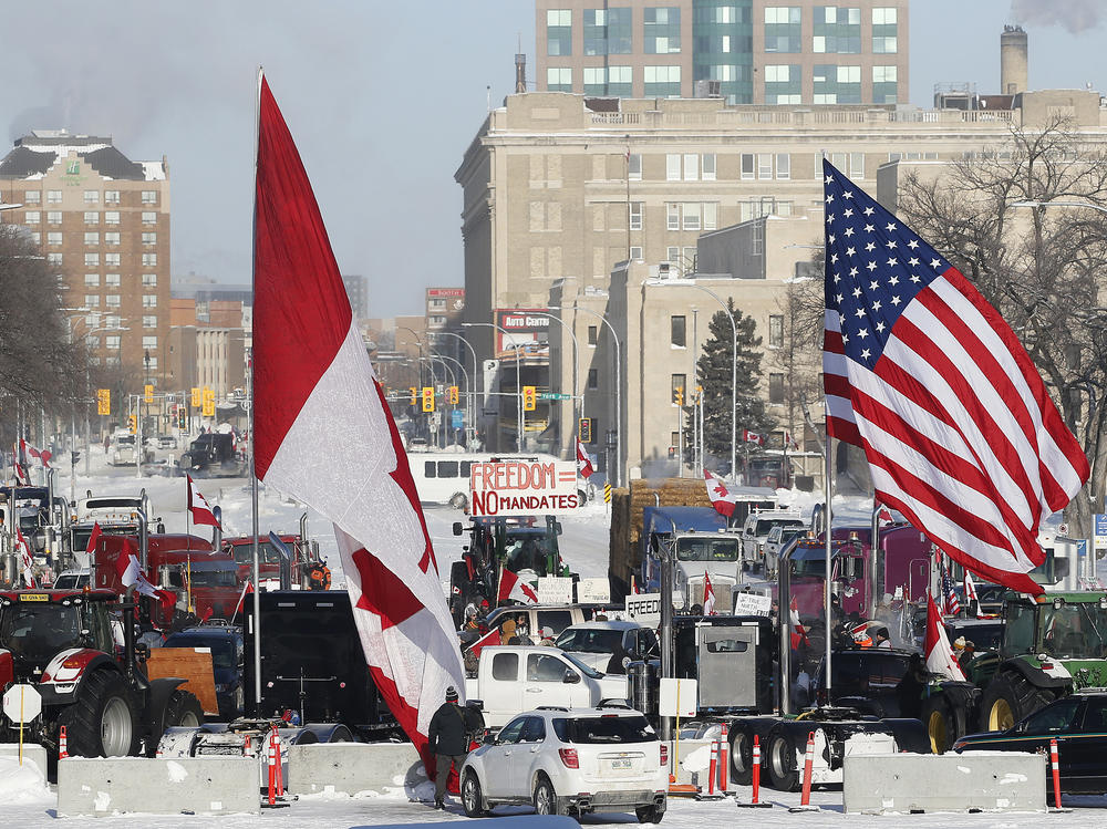 Demonstrators rally against provincial and federal COVID-19 vaccine mandates and in support of Ottawa protestors on Friday outside the Manitoba Legislature in Winnipeg.