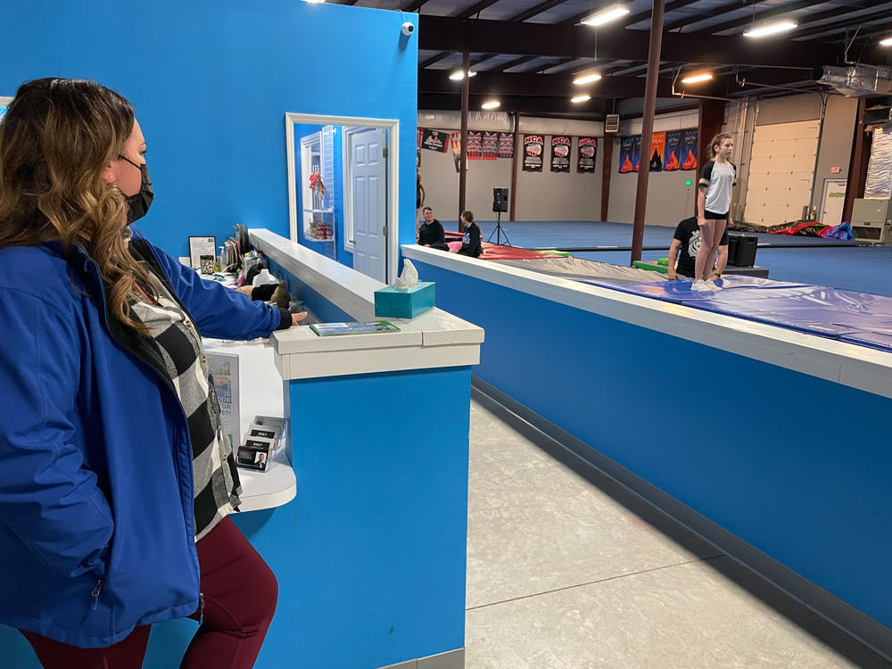 Nurse Sara Dean of Mount Juliet, Tenn., cheers on her daughter, Harper, as she perfects her back handspring. Dean says she stopped taking traveling jobs when 12-year-old Harper was ready for her to return home.