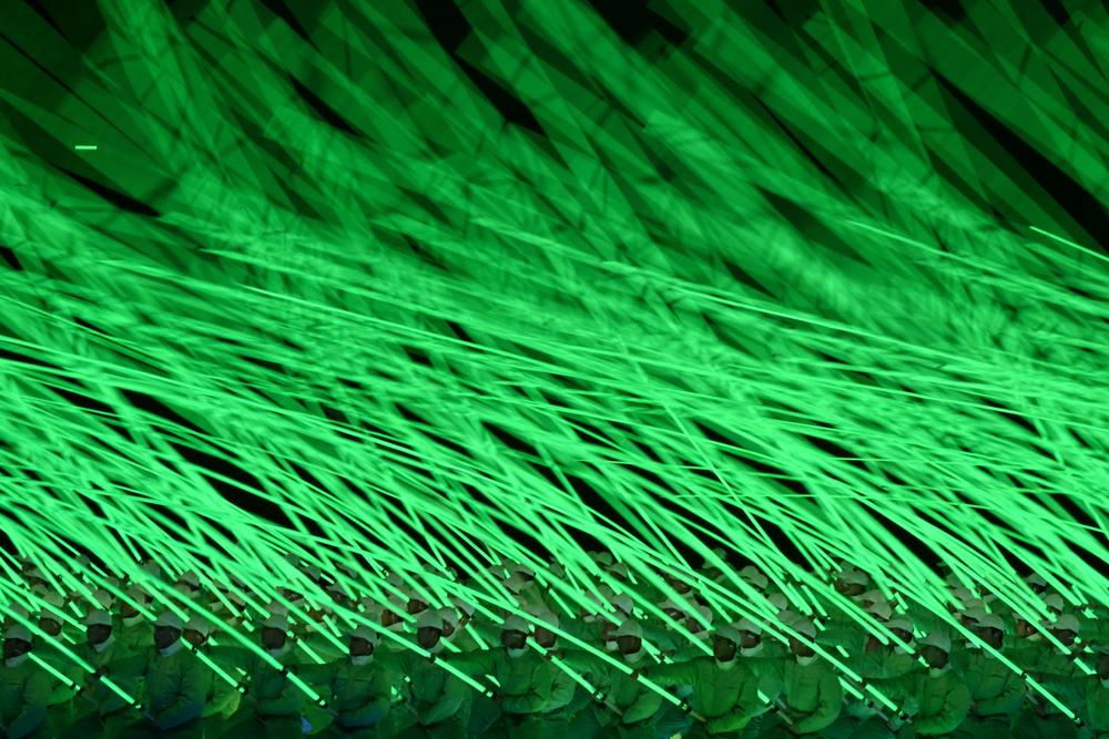 Performers take part in the opening ceremony at the Bird's Nest.
