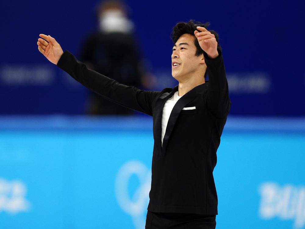 Nathan Chen of the United States wraps his performance in the men's single skating short program team event during the 2022 Winter Olympics at Capital Indoor Stadium on Friday.