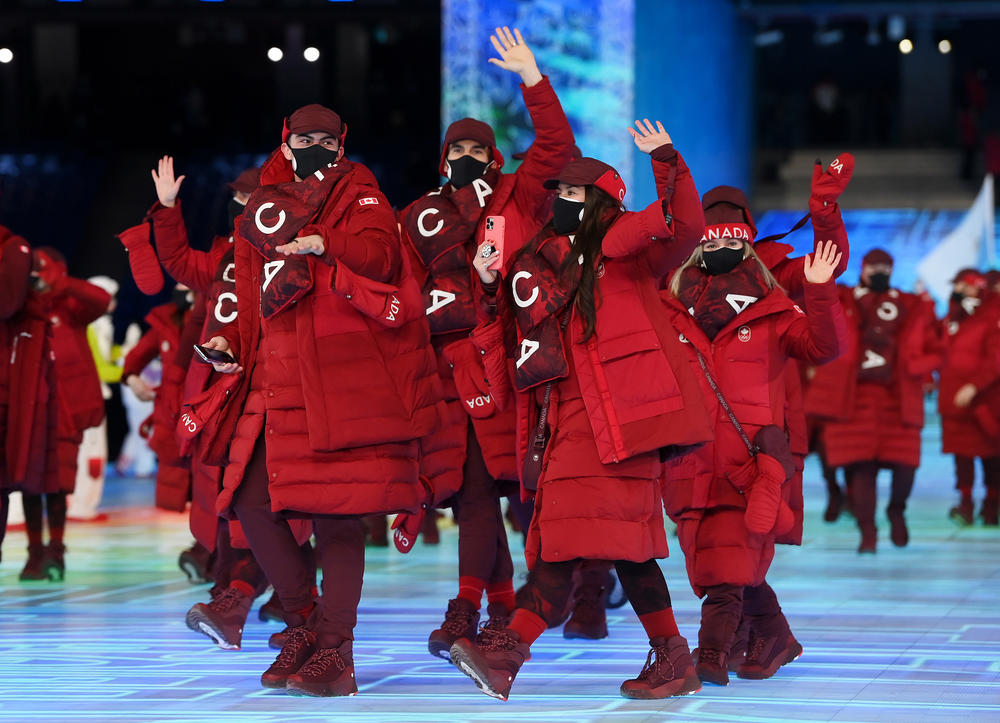 Members of the Canadian Olympic team wave during the opening ceremony.