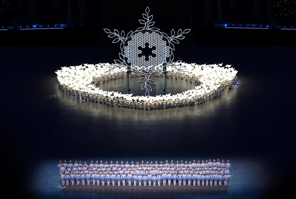 A large snowflake symbol is seen during a performance at the opening ceremony.