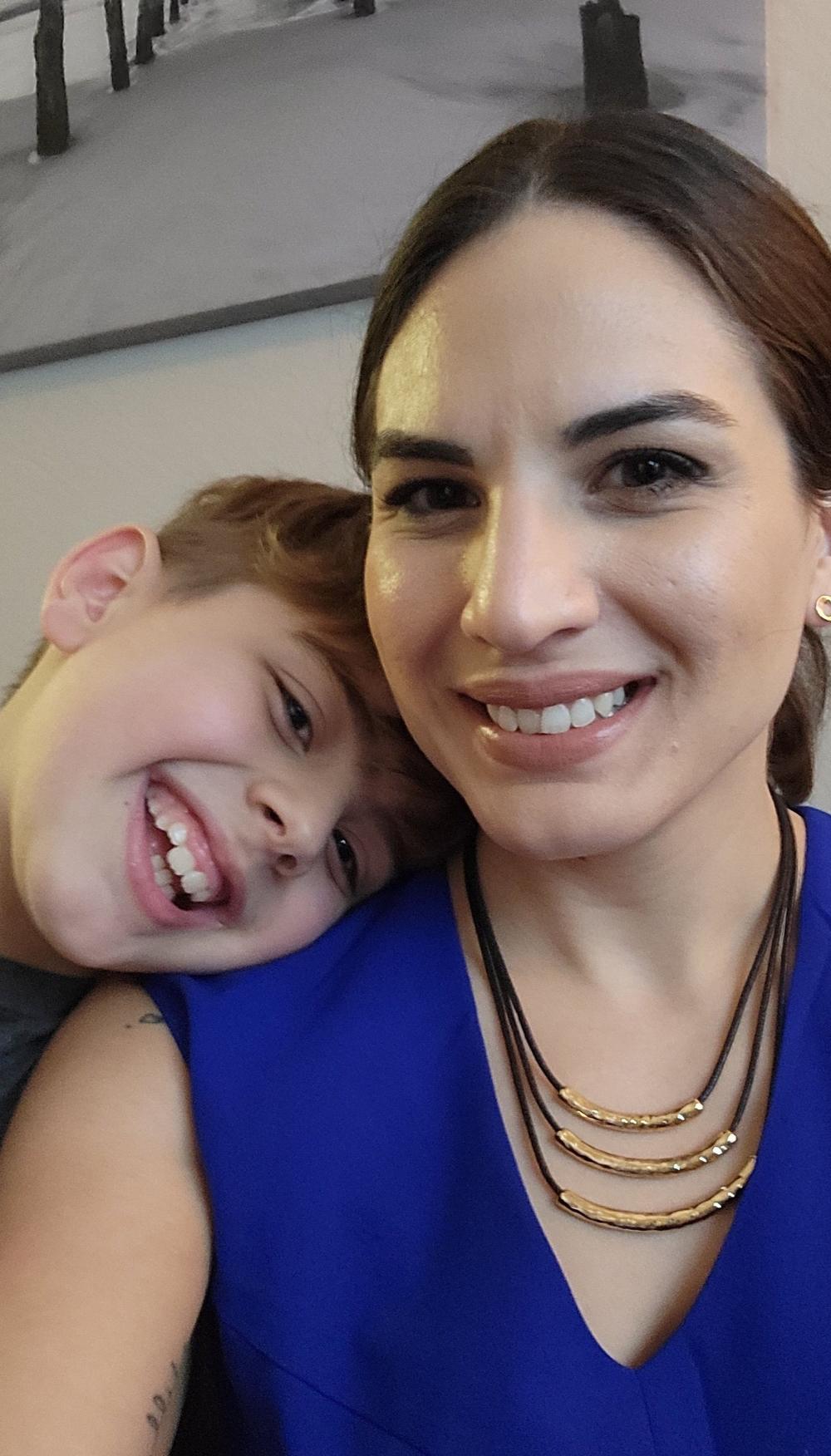 Sarah Ahmed and her 9-year-old son, Alex, at their apartment in Tampa, Florida. Ahmed got stuck paying more than $2,000 in interest on a $2,300 loan from an online lender. Consumer groups want the FDIC to stop these 