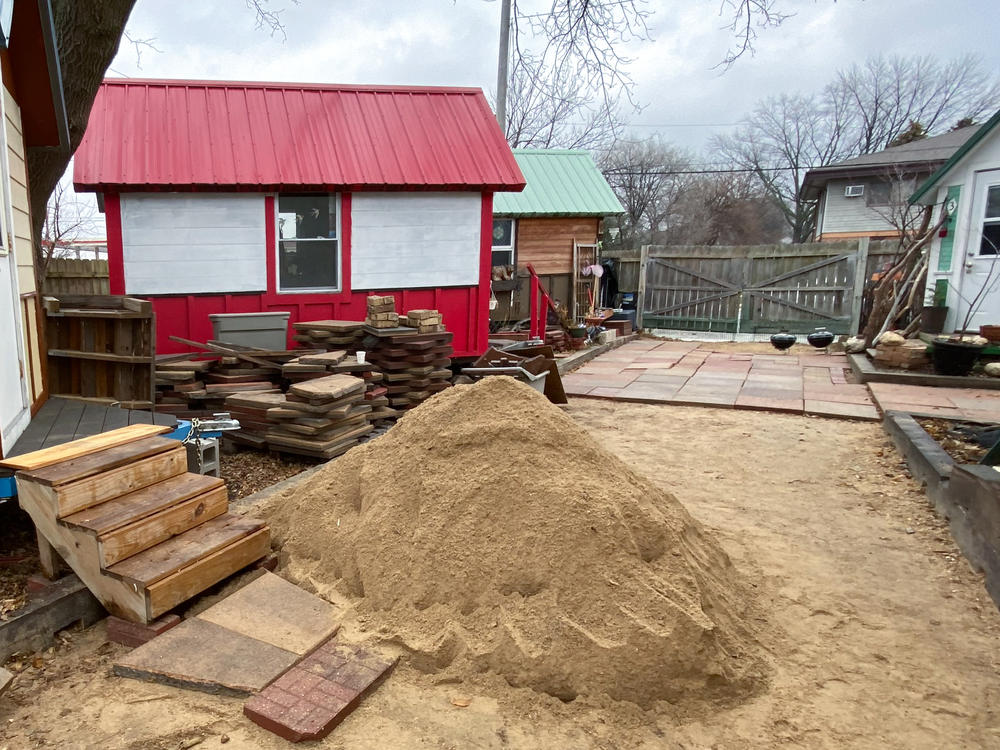 Part of an Occupy Madison tiny home village in Madison, Wisconsin, was under construction in December, 2021. The community also has a woodworking shop where it makes items to sell to support itself, including birdhouses that resemble the tiny houses.